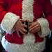 Danny Maier buckles his belt and asks his family if his belly is jolly enough on Sunday. Daniel Brenner I AnnArbor.com
